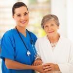 senior woman and caring young nurse