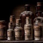 Antique pharmacy jars over wood table