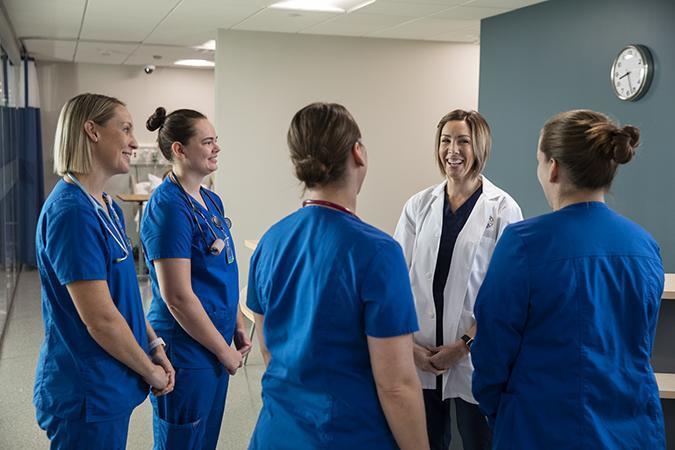 Thank You - A group of people standing in a room - Hospital