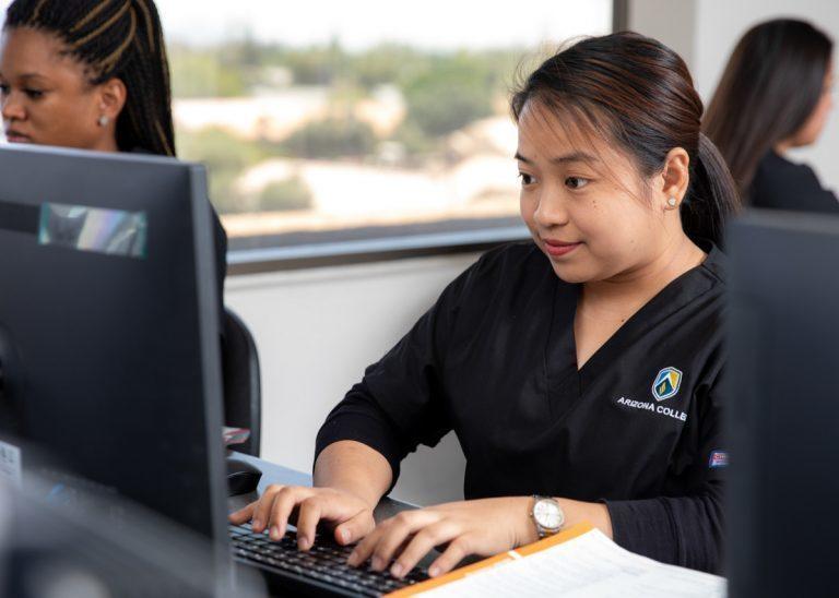 Allied Health program student at the computer at Arizona College