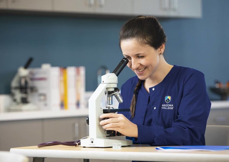 Nursing college BSN program student with microscope
