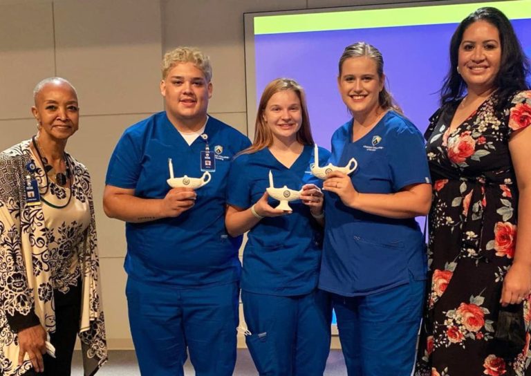 nursing college students with lamp