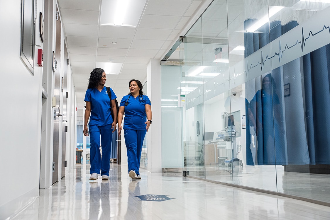 Nursing school students walking in hallway