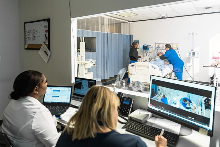 Nursing Degree Program Faculty and Students in lab