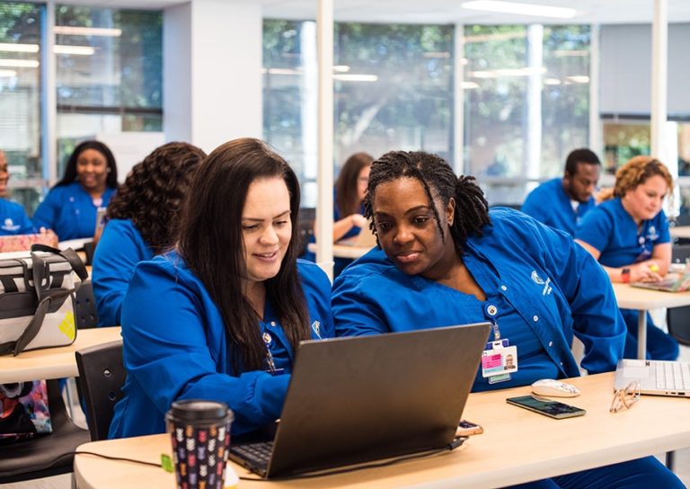 Nursing School BSN program Students In Class With Computer