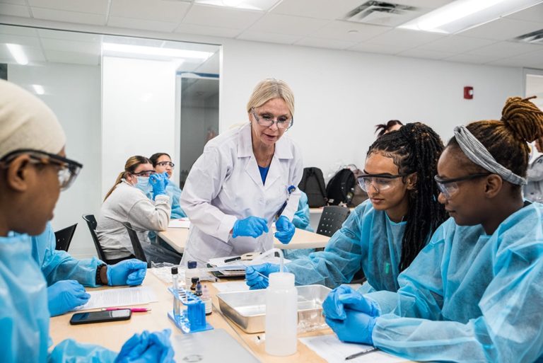 Nursing Program Students and Teacher in lab Coat